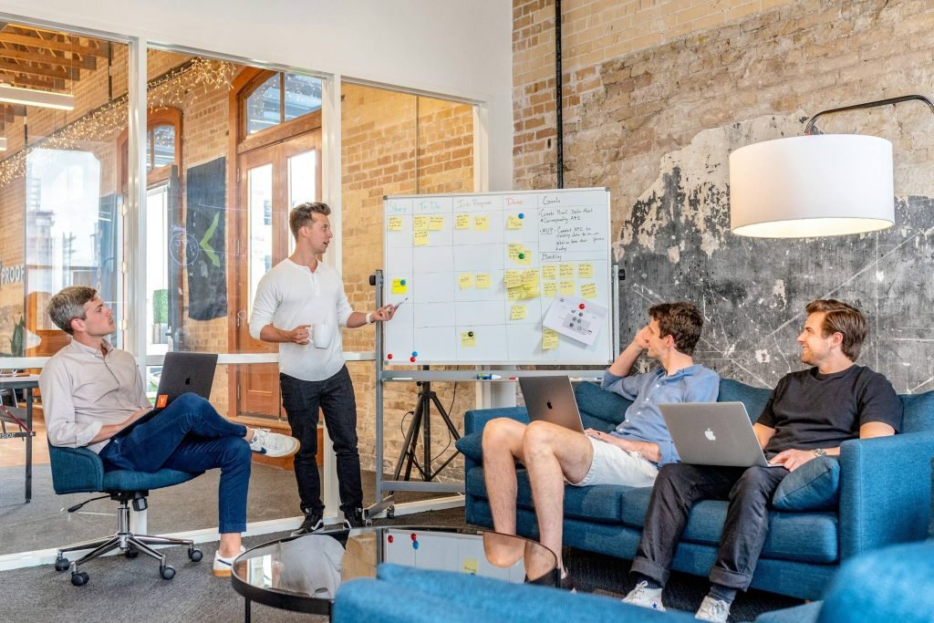 Consultant leading a workshop at a whiteboard